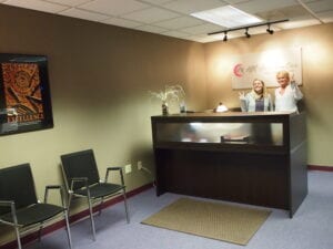 Reception area with seating and a front desk.